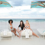 Three women relaxing by the beach at Shan’s 40th Anniversary Gala at the St. Regis Residences Sunny Isles Beach