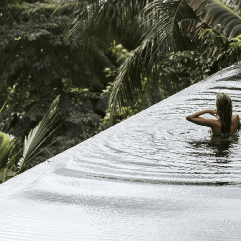 Person in serene infinity pool at One Beverly Hills
